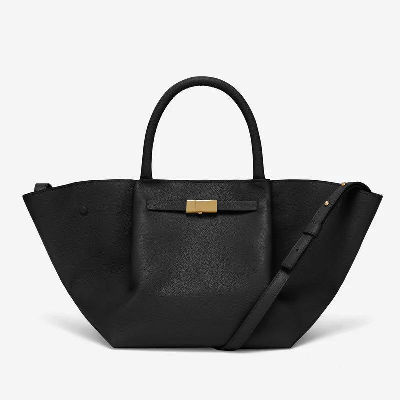 

Demellier wing bag leather shoulder portable tote bag premium sense women s bag large capacity commuter dumpling bag