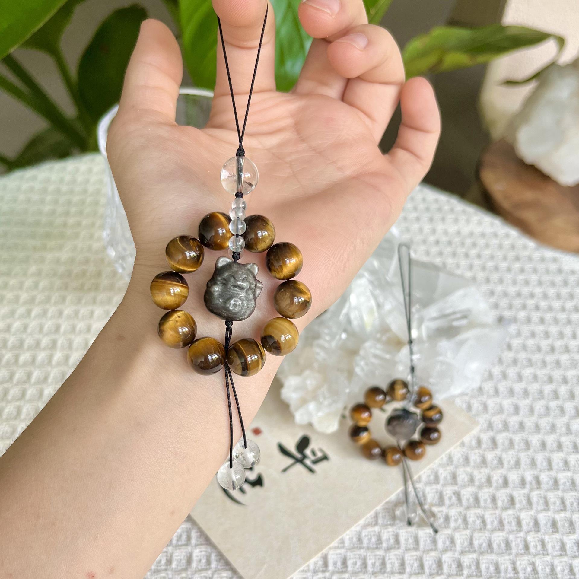 

2025 Оригинальный обсидиан Тигровый глаз Резной котенок Шарм для телефона, Дизайн высокого класса.