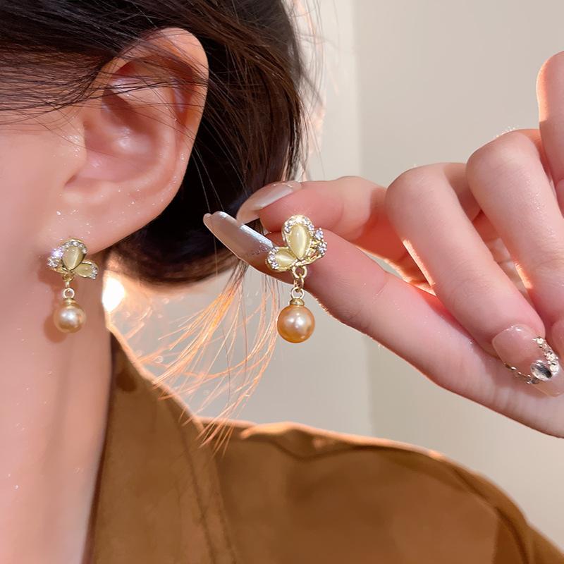 Champagne butterfly pearl earrings women s unique design sense opal stud earrings Korean version retro earrings