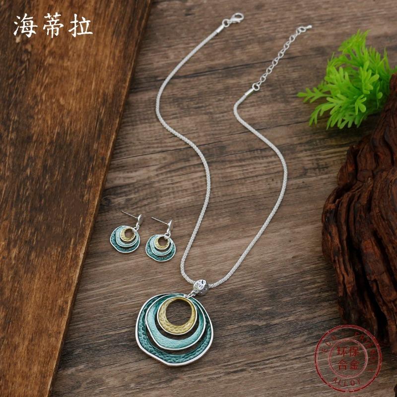 New enamel three-layer round ring stud earrings pendant set, women's simple and advanced sense hollow ring necklace