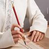 Cold River Snow Calligraphy Brush Set: Soft Brush for Beginners with Creative Gold Splatter Design and Solid Wood Pen Holder for Writing Practice.