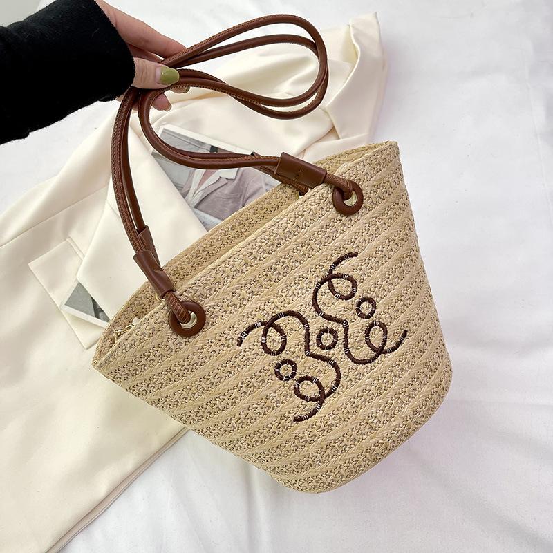 

Large capacity bag women s 2025 new woven straw bag satchel drawstring zipper beach straw bag bucket shoulder bag