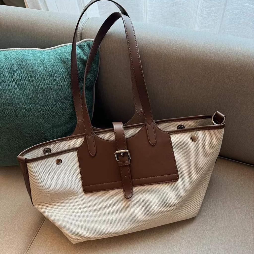 Niche Canvas Cowhide Tote Bag Large Capacity Wing Bun Mother Bag Casual Armpit Bag Women's Shoulder Bag