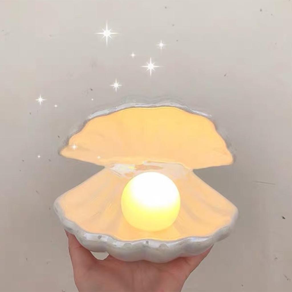 Veilleuse LED 3D en forme de coquillage, jaune chaud, alimentée par piles, idéale pour une chambre d'enfant ou un salon