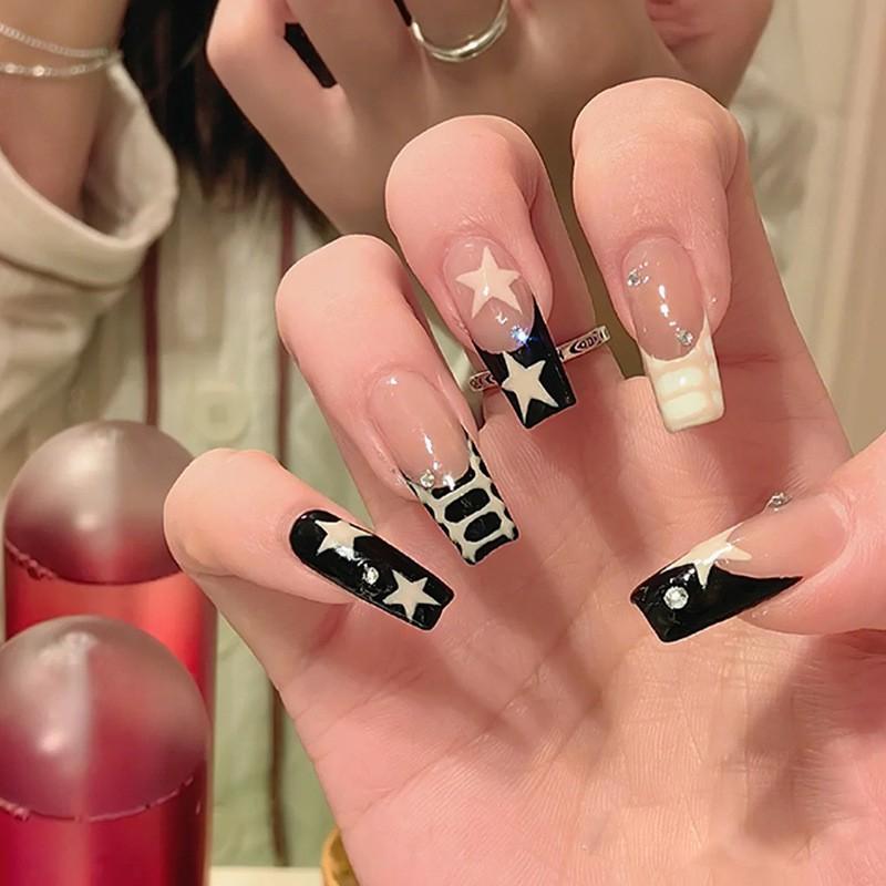 Wearing Nail Plates In Black Creamy Yellow Contrasting French Style Paired With Milky White Starry Rhinestone Fake Patches