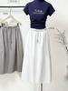 2026 Spring/Summer Retro Cocoon Mid-Length Elastic Waist Skirt - Stylish Solid Color Artistic Bud Design