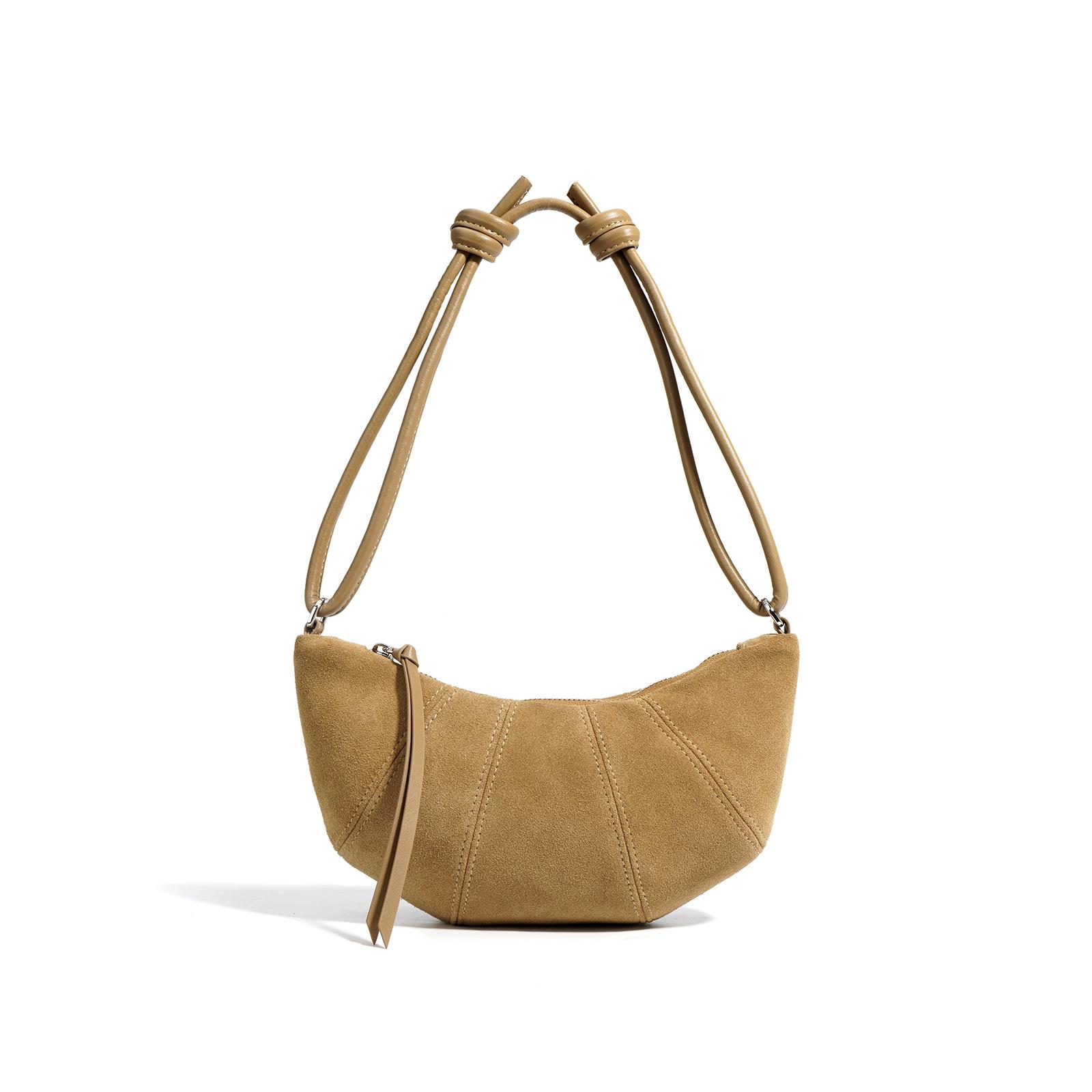 

Сумка из бычьего рога — воплощение изысканности для женщин. Это нишевая сумка-пельмень для осени и универсальная сумка через плечо хаки