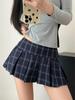 Mini-jupe plissée taille basse à carreaux bleus style rétro américain pour femme