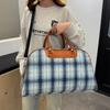 Simple casual nostalgic large-capacity outdoor handbag household seasonal clothing storage luggage