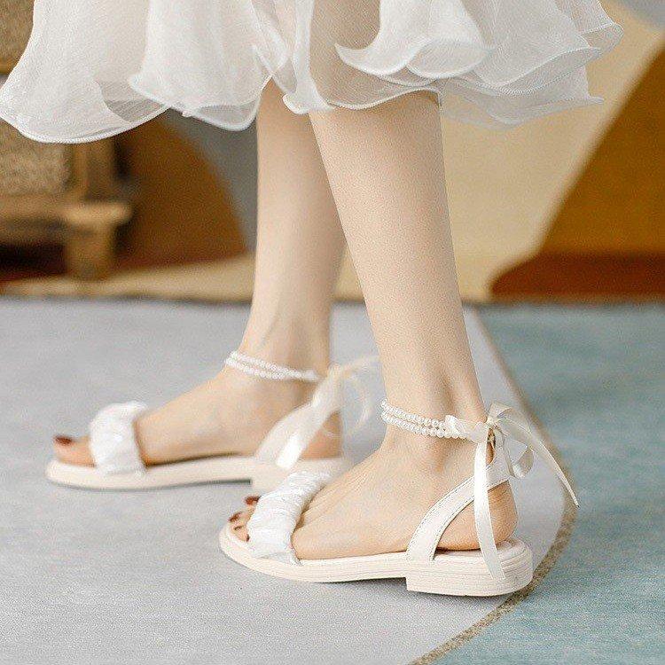 

Женские летние сандалии на мягкой подошве, новые, универсальные, нескользящие, с темпераментом, с юбкой, ремешок на одно слово, жемчужные женские туфли 40