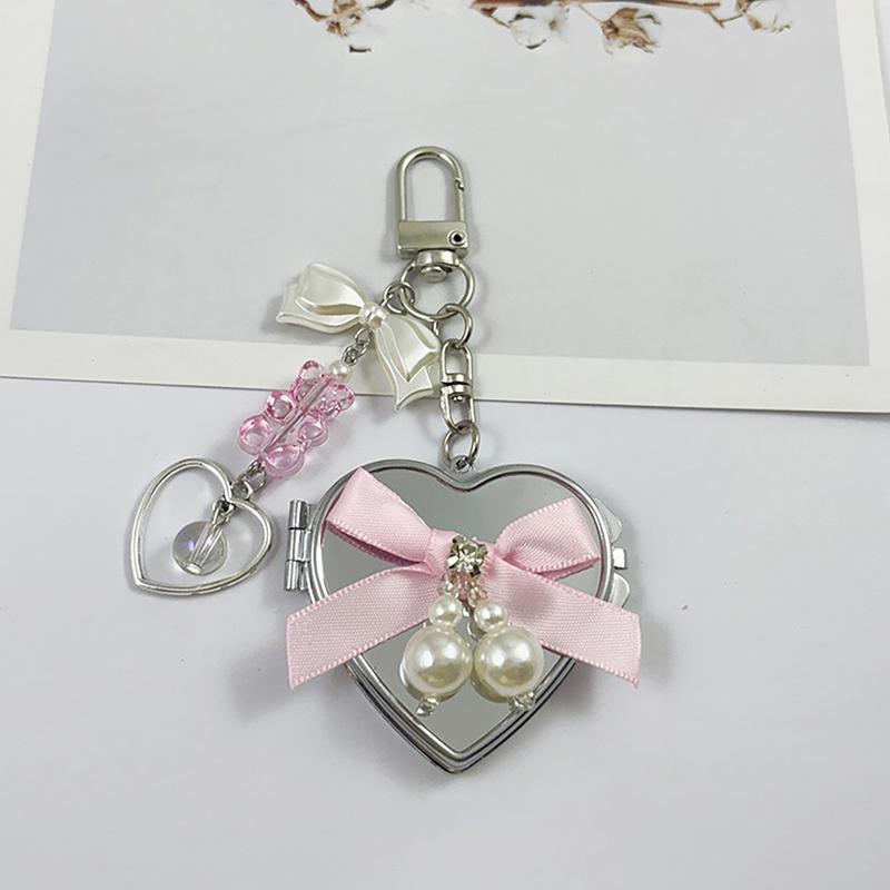 Perlen Schleife Metall Schlüsselanhänger mit herzförmigem Spiegel Y2K Stil Taschen Schlüsselanhänger Süß Cool Trendig Kopfhörer Kamera Anhänger