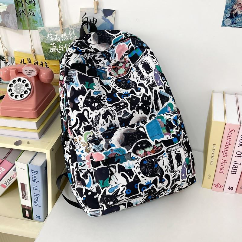 New high-value niche personalized graffiti comics trendy cool backpacks for men and women lightweight large-capacity backpacks