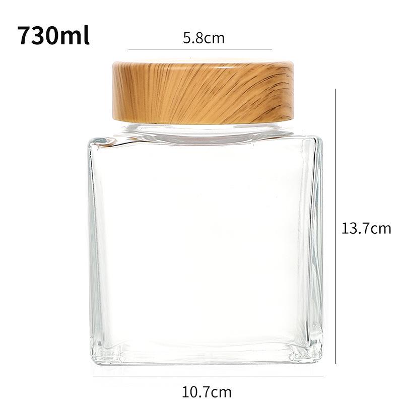 Verdickte flache quadratische Glasflasche mit Holzmaserung für Honig oder Marmelade