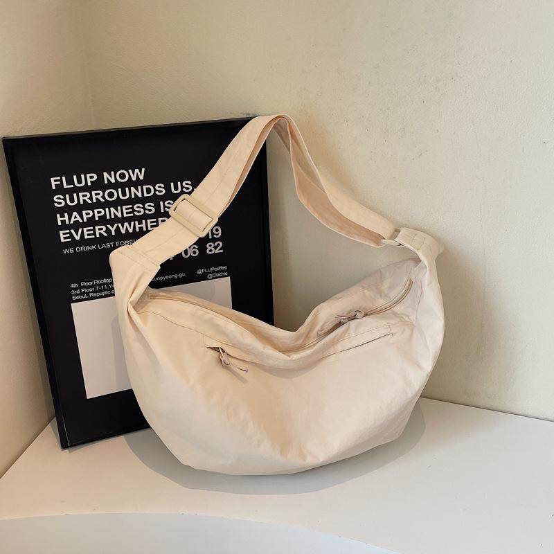 2025 women's bag Korean version ins canvas dumpling bag fashion casual messenger bag simple breast bag trendy bag