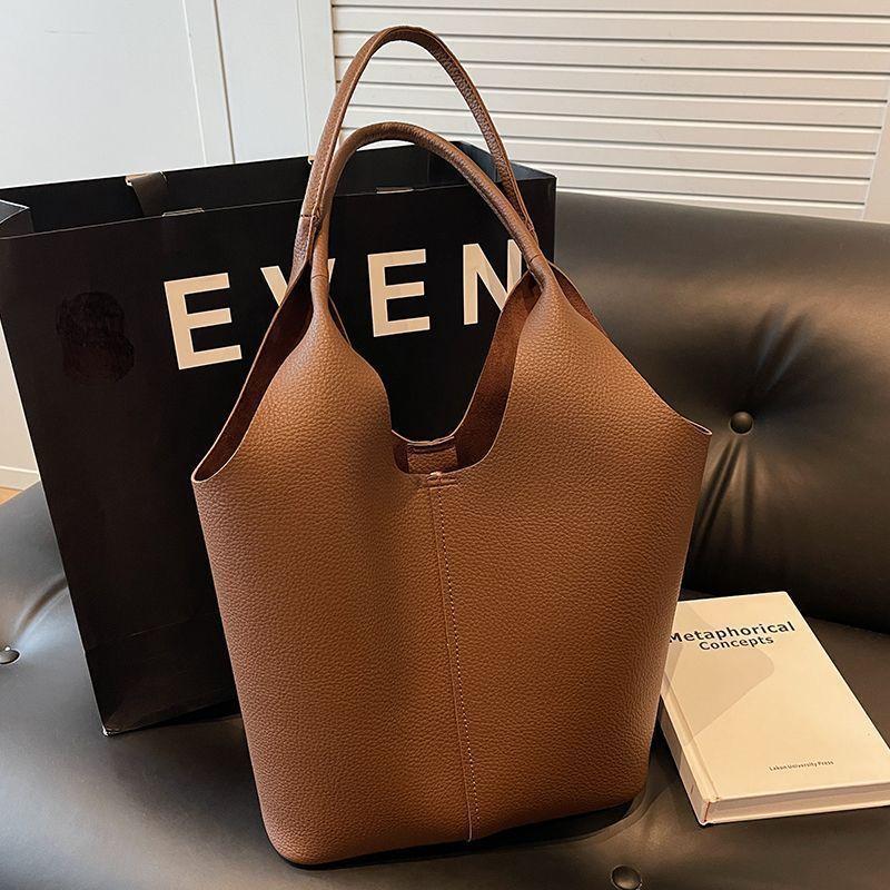 

Large capacity bag women s new Korean version fashion one shoulder armpit bag casual commuting soft surface portable bucket bag темно-коричневого кольору