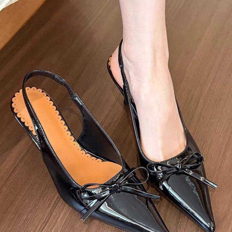 

The Wizard of Oz! Pointed bow high heels women s 2025 spring new thin heel spring patent leather rear empty sandals 40