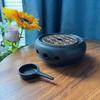 White Porcelain Tea Set with Black Ceramic Stove and Candle Base