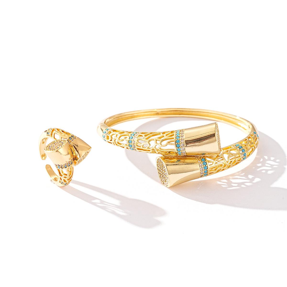 

Розкішний комплект браслета та каблучки із золотистої міді | Геометричні квіткові візерунки з акцентами з кристалів