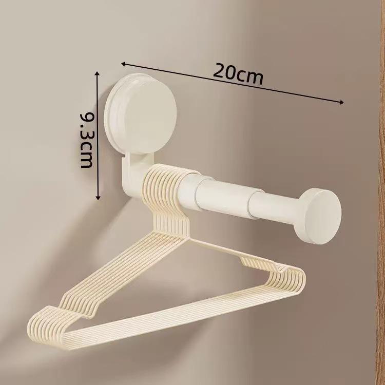 Telescopic No-Punch Suction Cup Wall Rack: Multi-functional Balcony Clothes Storage and Hanger Shelf with Traceless Hooks.