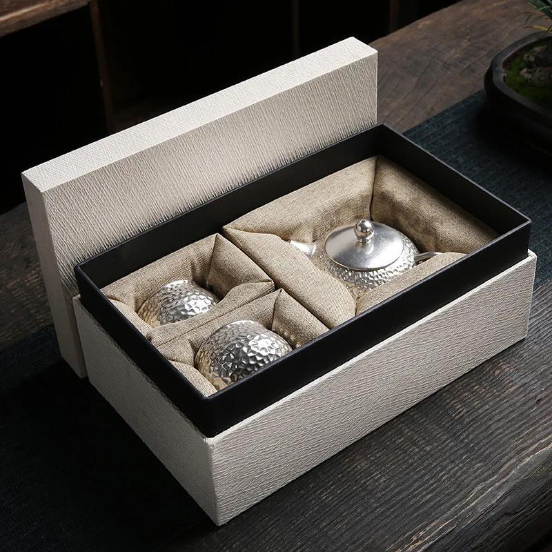 

Керамический позолоченный серебряный набор для экспресс-чашек с одним чайником и двумя чашками в японском стиле с узором «молоток» в стиле кунг-фу. Подарочная коробка для домашнего чайного сервиза