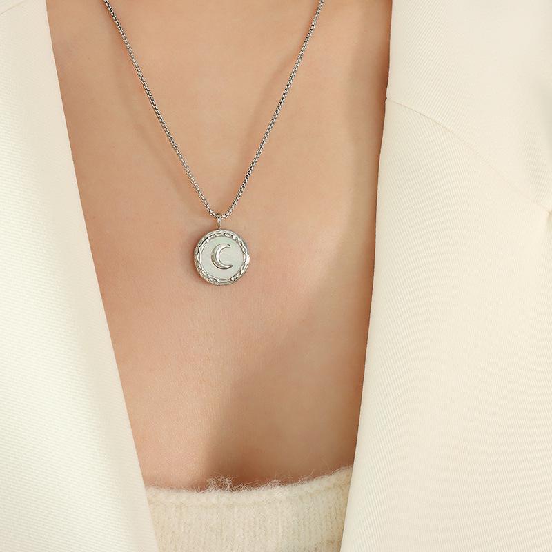 Women's Titanium Steel Jewelry Set: Crescent Moon Necklace, White Shell Earrings, and Non-Fading Bracelet.