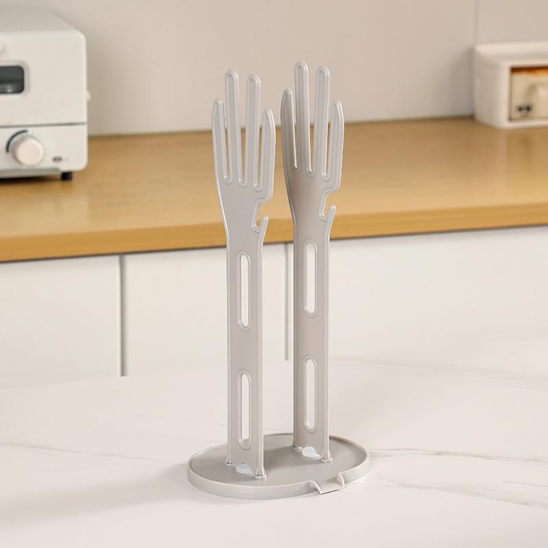 

Hand-Shaped Glove and Dishcloth Drying Rack with Water-Draining Hook and Suction Cup Storage.