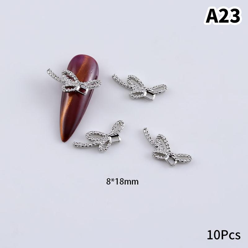 10 шт. Шармы для ногтей из серебряного сплава Ювелирные изделия 3D Крылья бабочки Украшения Роскошный металлический бант Маникюр Алмазные аксессуары A23