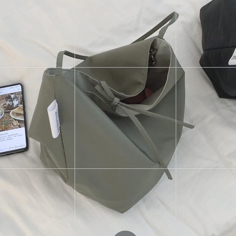 

Casual large-capacity bag women s 2025 simple canvas bag versatile one-shoulder armpit bag student class bag handheld зелёный