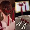 Wine Red Bridal Gown Earring Set with Rhinestone Tassel Headpiece, Flower Hair Clips, and Chinese Toasting Dress Accessories.