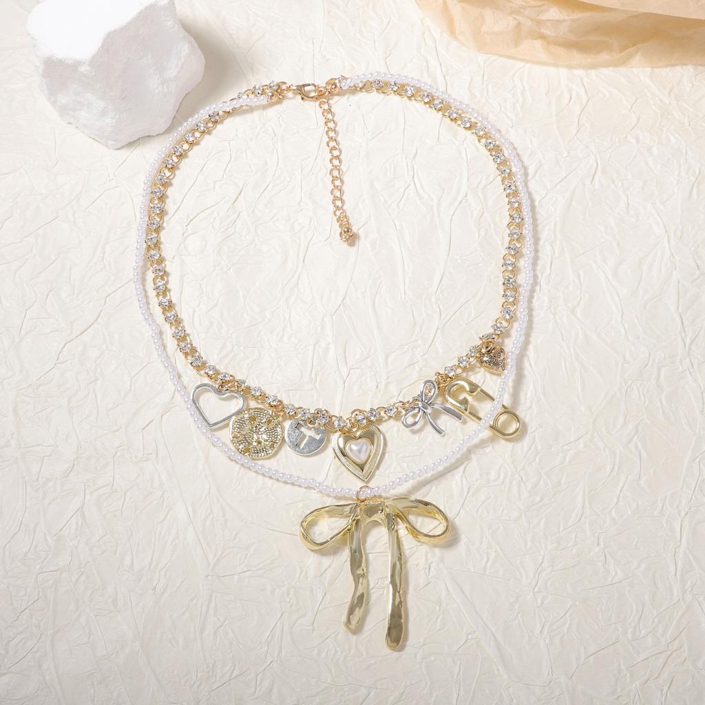 Fashion niche creative design sense double-layered alloy bow pendant necklace versatile temperament model