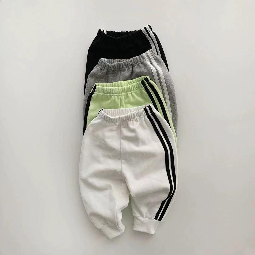 Korean-Style Unisex Baby Sweatshirt and Pants Set - Solid Color with Webbing Stripe Patchwork for Autumn and Spring.