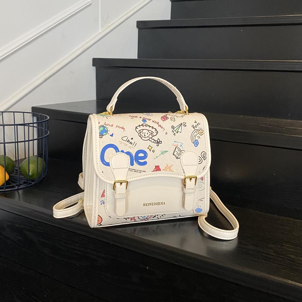 Korean version of college style cute cartoon printed handbag women 2025 new fashion casual backpack student schoolbag