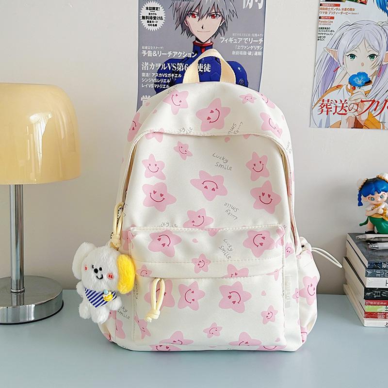 Nowy tornister jest wysokiej jakości, świeży, słodki i uroczy, a plecak w gwiazdki to lekki plecak podróżny dla uczniów gimnazjum.