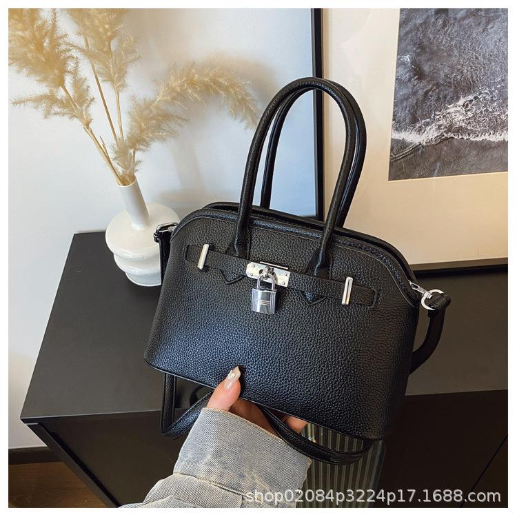 2025 new women's lychee pattern solid color lock shoulder bag temperament niche versatile commuter portable messenger