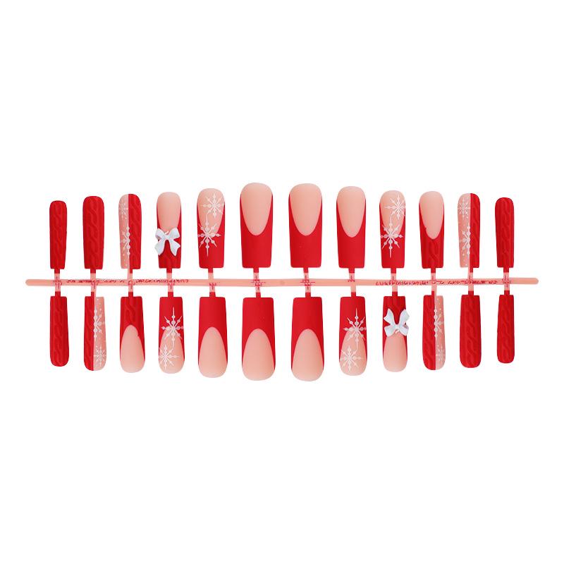 

Christmas Snowflake Press-On Nails with Sweater Texture and Bow - Ready-to-Wear Nail Art Pieces