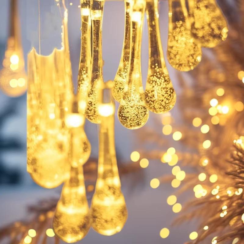 Solar LED Water Drop String Lights: Colorful, Moisture-Proof Decorative Lighting for Festivals, Hotels, and Courtyards with Ground Plug Feature.