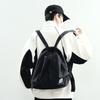 The new Hong Kong wind locomotive drawstring is simple andlarge-capacity leisure. Men and women have the same commuter backpack and student schoolbag.