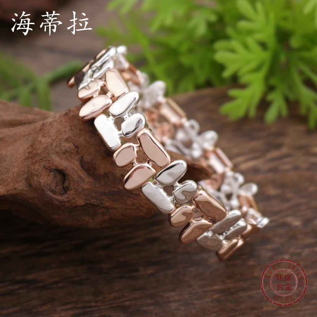 Hohles geometrisches Linien-Elastikarmband, personalisiertes vielseitiges zweifarbiges Zinklegierungsarmband für Damen und Herren