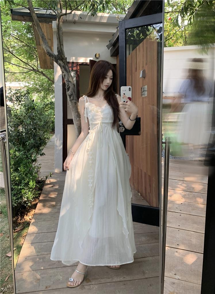 Holiday style flower design suspender dress women's 2026 summer new waist thin very fairy long skirt