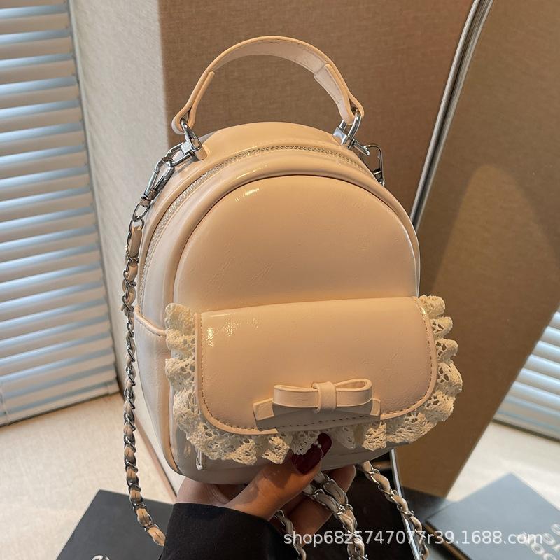 Korean fashion hand-held crossbody bag women's 2025 summer new simple bow backpack casual school bag