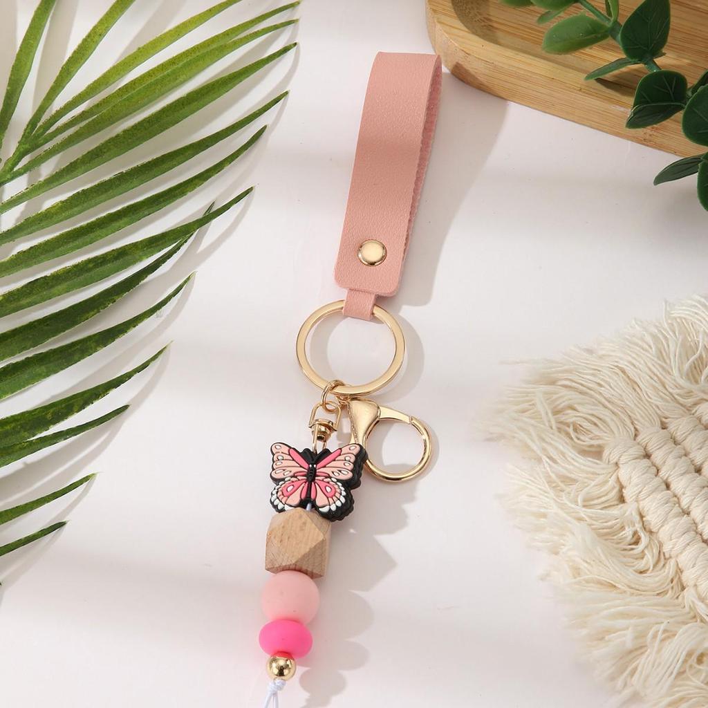 European & American Sweet Butterfly Daisy Silicone Beaded Keychain with Leather Bow Pendant