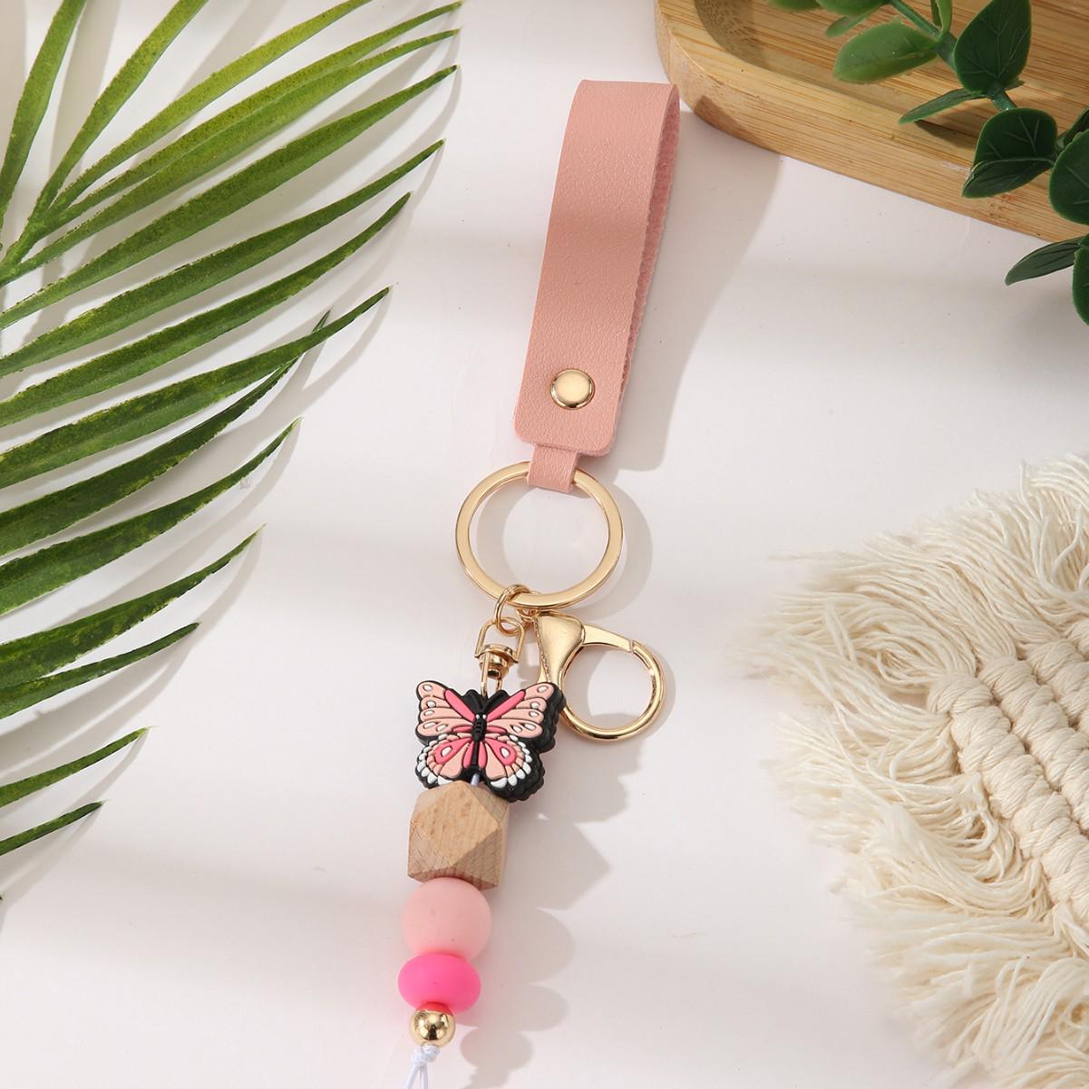 European & American Sweet Butterfly Daisy Silicone Beaded Keychain with Leather Bow Pendant розовый