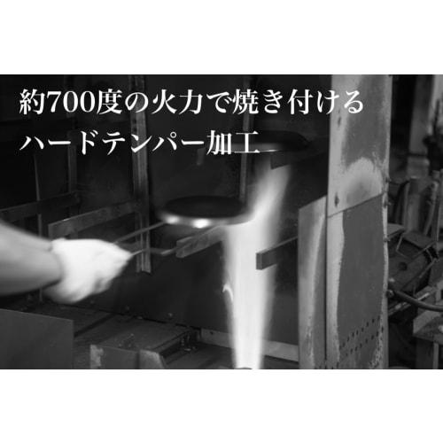 The Little China 24 Iron Frying Pan, a small iron wok that develops with use. Made in Japan, induction compatible, lightweight, no seasoning required,