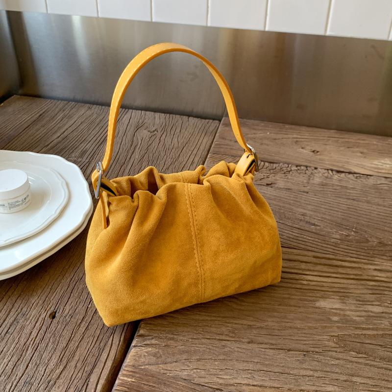 

2025 autumn and winter new retro large-capacity bucket bag Korean niche design messenger bag fashionable handbag жёлтый