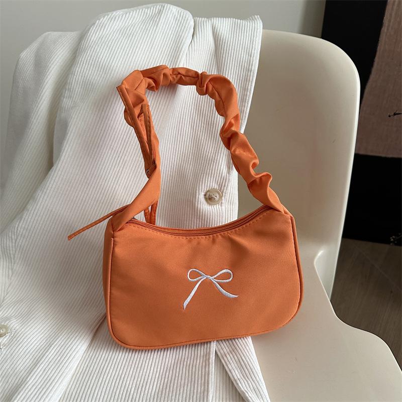 

2025 new niche design bow underarm bag women s high-end shoulder messenger bag fashionable versatile bag оранжевый