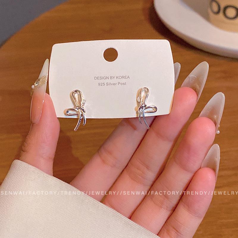 

Cold wind silver bow stud earrings women s simple niche unique earrings temperament earrings
