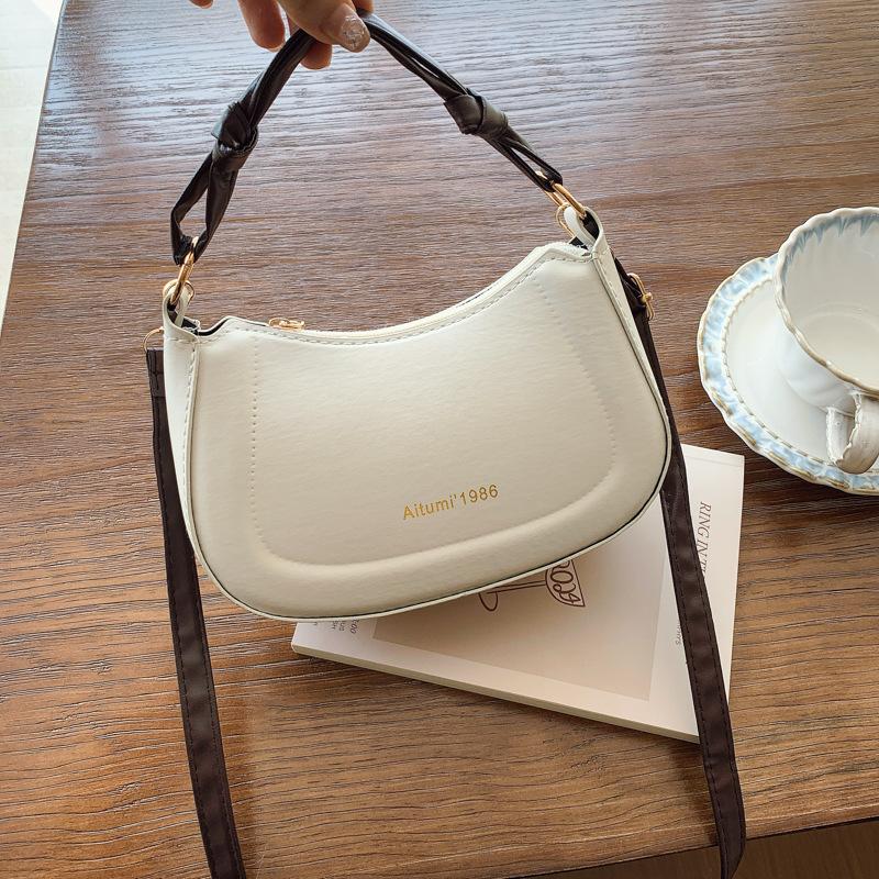 

Summer new light luxury versatile personalized armpit bag women s light luxury commuting fashion solid color fresh design shoulder bag