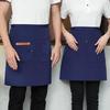 Unisex vanntett kjøkkenforkle i kanvas med halvlangt design og logo i midjen