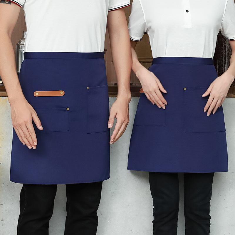 Unisex vanntett kjøkkenforkle i kanvas med halvlangt design og logo i midjen