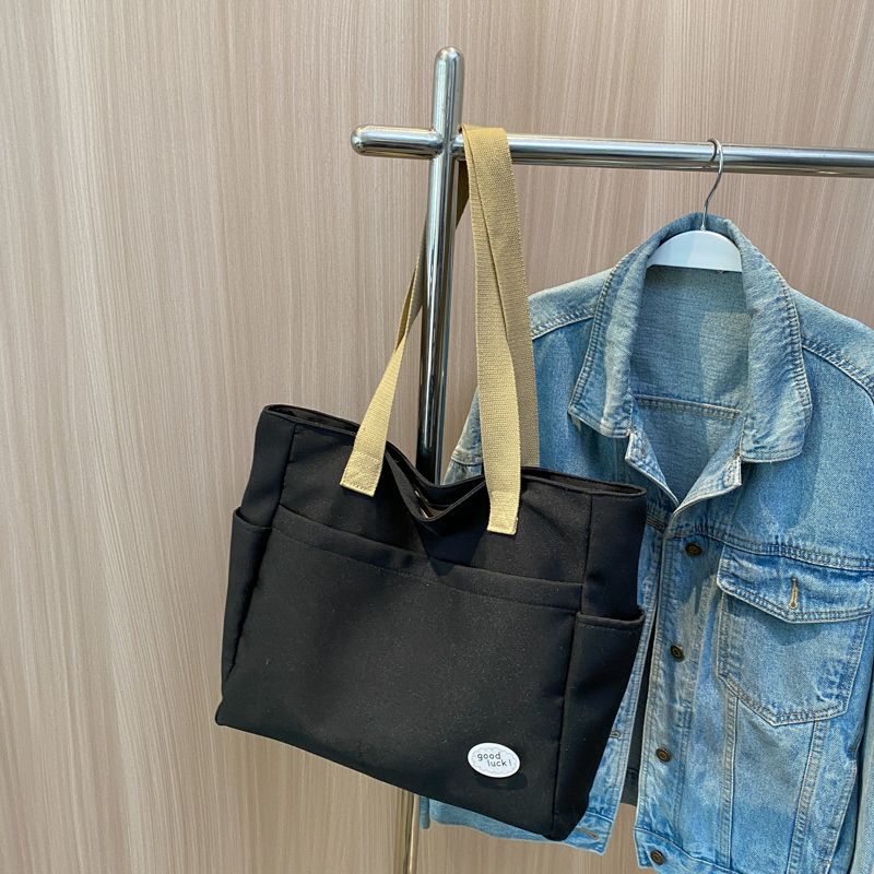 Large capacity lazy wind canvas bag women's solid color niche shoulder handbag casual versatile commuter tote bag
